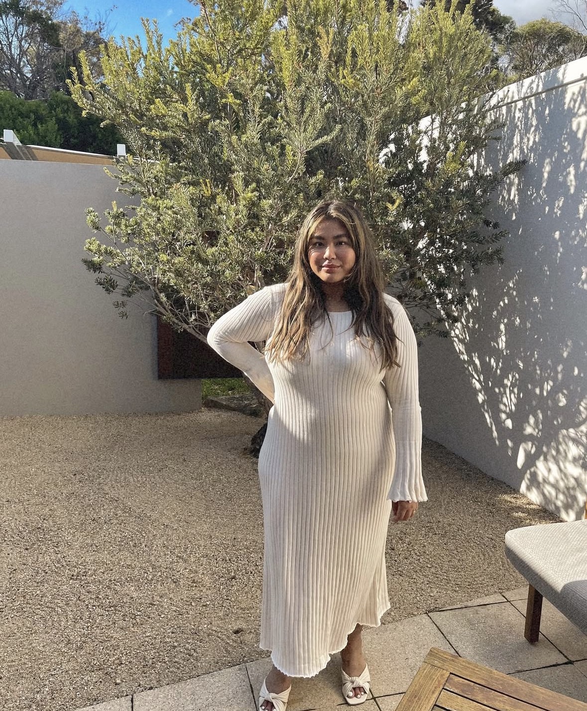 Jewel at the beginning of her journey in a ribbed knit dress